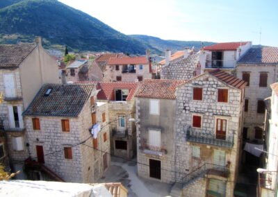 A Group Of Buildings With Red Roofs