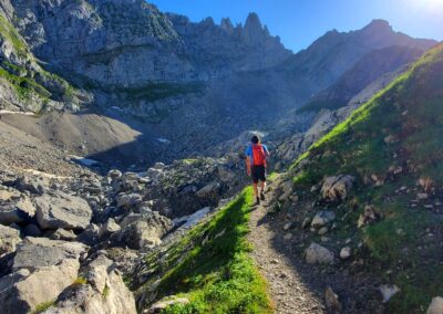 A Man Walking On A Rocky Trail