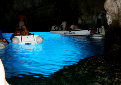 People In A Boat In A Cave