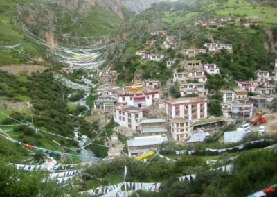 A Group Of Buildings On A Hillside