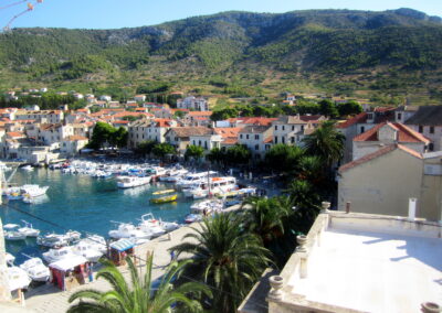 A Harbor With Boats And Buildings In The Background