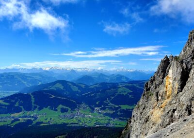 A Mountain With A Valley And A Town In The Distance
