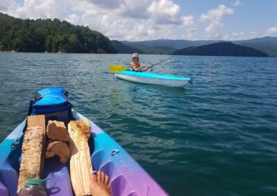 A Person In A Kayak On A Lake